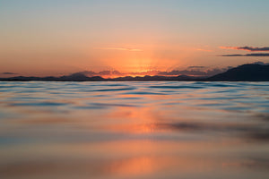 SUNSET OVER THE OCEAN